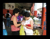 Angie and Shu Fong found a friendly fruit vendor outside Young Sing's where they bought Papaya, oranges, etc.